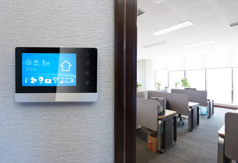 Smart climate control system in an office, adjusting temperature and air quality based on real-time data to enhance comfort and energy efficiency.